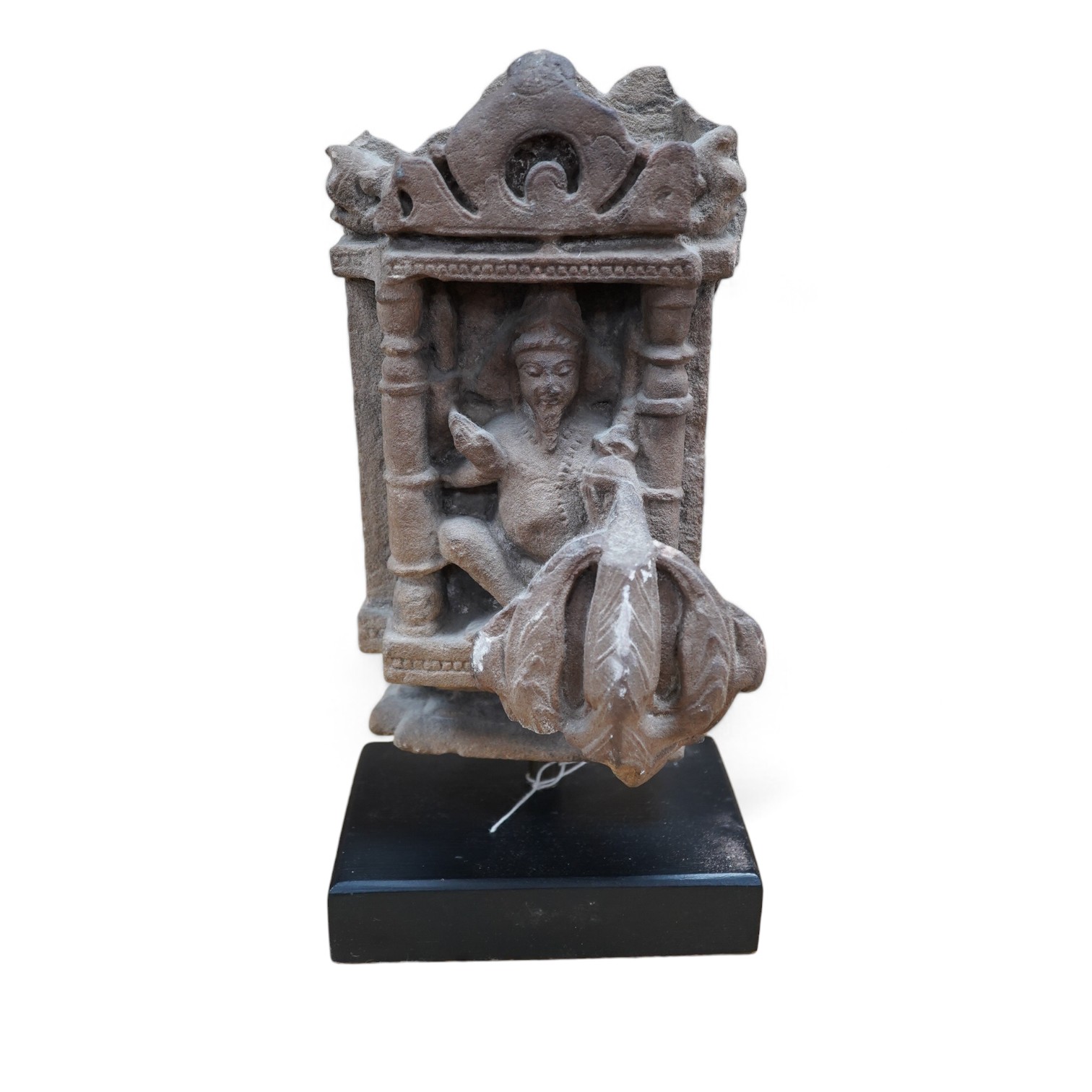 An Indian Hindu sandstone carving of Brahma the Creator, 14th century, 33cm high overall. Condition - commensurate with age